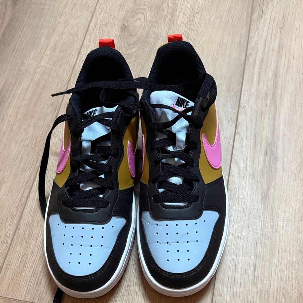 Nike Black and Pink Sneakers with Gold Accents